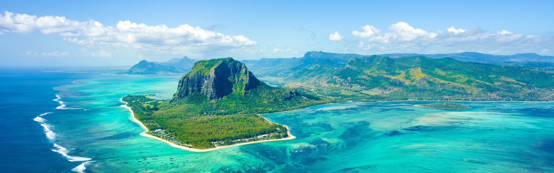The republic of Mauritius comprises of several islands located in the south-east of the Indian Ocean. The main island is 2,000 kilometers away from the eastern coast of Africa. Foreigners thoroughly enjoy its beaches and sea as well as its culture. Mauritians are welcoming and different cultures coexist peacefully here. While the island has evolved and kept up with the needs of modern times, it has not let go of its roots.